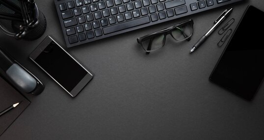 Office Supplies With Computer Keyboard On Gray Desk