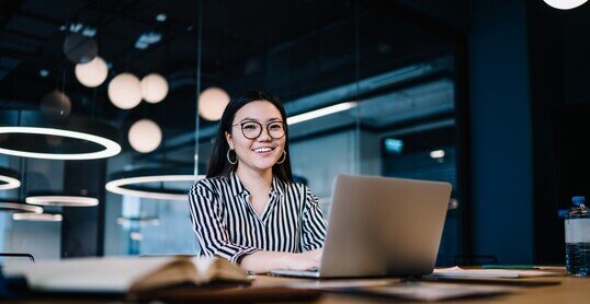 Happy woman working with laptop